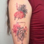 Fineline Schwarz-Rot Tattoo am Arm von CNX Tattoo Berlin Prenzlauer Berg